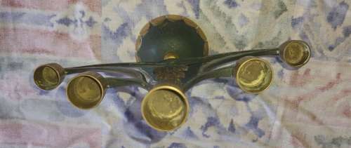 A BEAUTIFUL WRATH IRON AND BRASS MINORA IN GOOD CONDITION SOLD AS IS