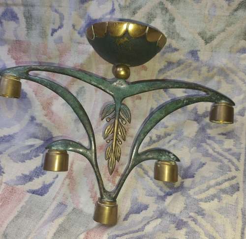 A BEAUTIFUL WRATH IRON AND BRASS MINORA IN GOOD CONDITION SOLD AS IS