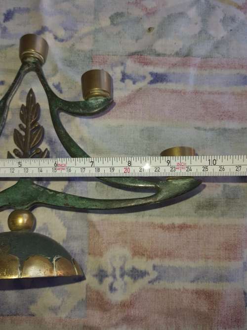 A BEAUTIFUL WRATH IRON AND BRASS MINORA IN GOOD CONDITION SOLD AS IS