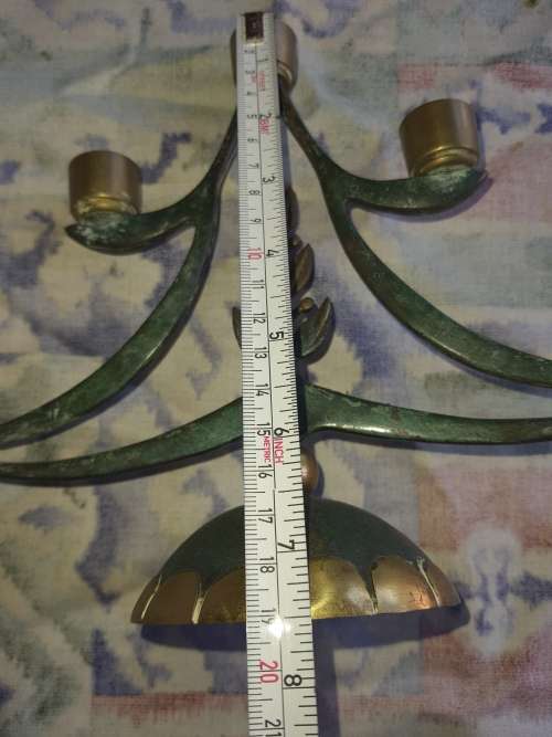 A BEAUTIFUL WRATH IRON AND BRASS MINORA IN GOOD CONDITION SOLD AS IS