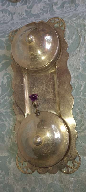 A SILVER PLATED WITH GLASS BOWLS AND A SPOON CONDOMENTS SET