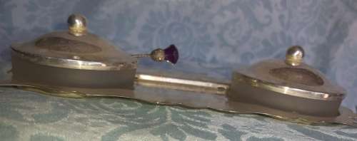 A SILVER PLATED WITH GLASS BOWLS AND A SPOON CONDOMENTS SET