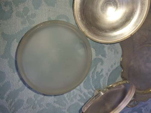 A SILVER PLATED WITH GLASS BOWLS AND A SPOON CONDOMENTS SET