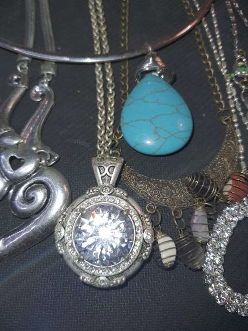 A BULK VINTAGE JOBLOT COSTUME NECKLACES AND PENDANTS SOLD AS IS