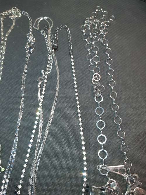 A BULK VINTAGE JOBLOT COSTUME NECKLACES AND PENDANTS SOLD AS IS