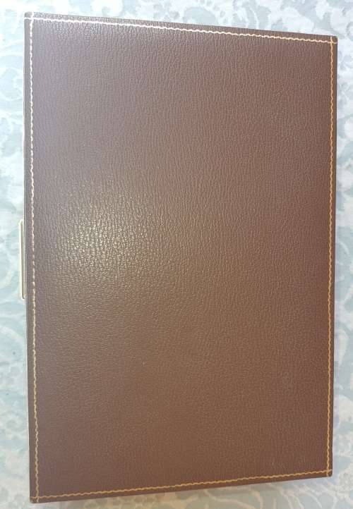 A NEAT BROWN LEATHER COVERED JEWELRY BOX IN GOOD CONDITON SOLD AS IS