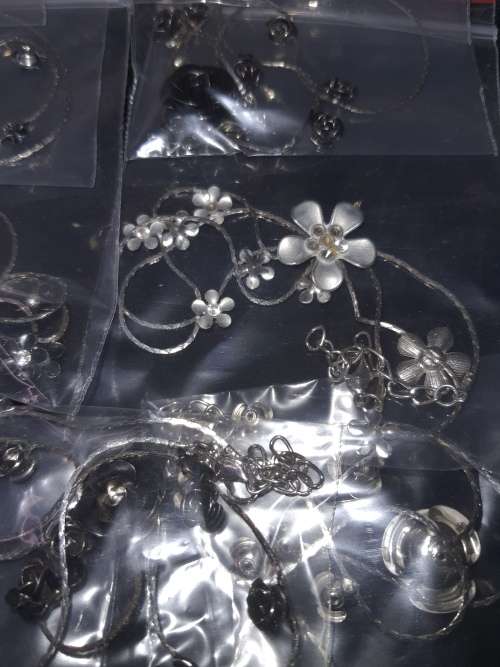 A MASSIVE BULK JOBLOT FANCY EARRINGS AND NECKLACES SILVER PLATED CHAINS AND FLORAL DESIGN  PENDANTS