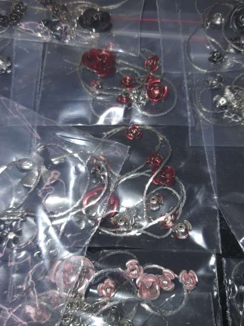 A MASSIVE BULK JOBLOT FANCY EARRINGS AND NECKLACES SILVER PLATED CHAINS AND FLORAL DESIGN  PENDANTS