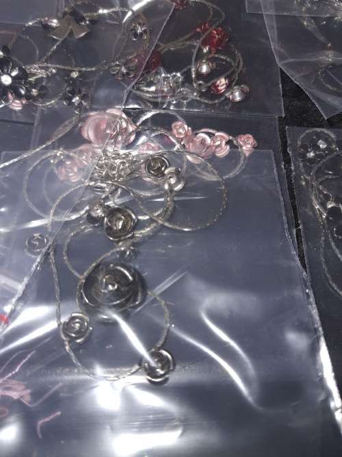 A MASSIVE BULK JOBLOT FANCY EARRINGS AND NECKLACES SILVER PLATED CHAINS AND FLORAL DESIGN  PENDANTS