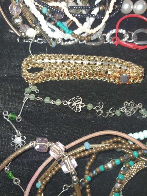 A RARE BULK COLLECTION OF QUALITY COSTUME BANGES AND BRACELETS SOLD AS IS