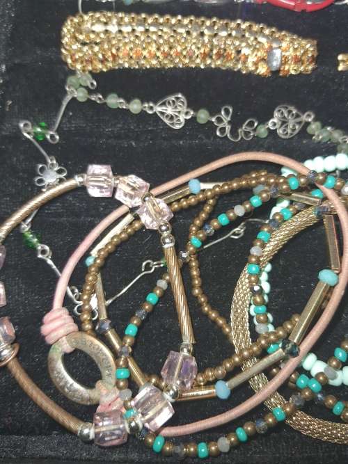 A RARE BULK COLLECTION OF QUALITY COSTUME BANGES AND BRACELETS SOLD AS IS