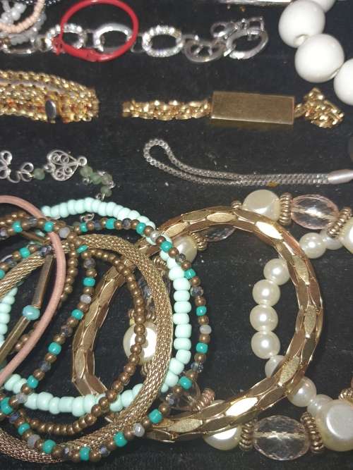 A RARE BULK COLLECTION OF QUALITY COSTUME BANGES AND BRACELETS SOLD AS IS