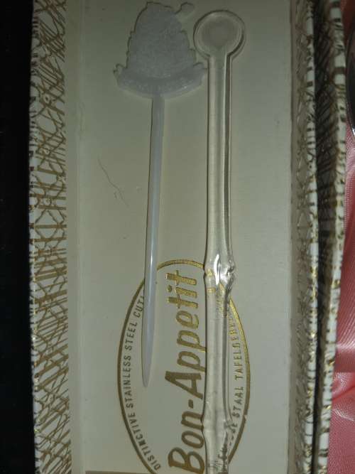 AN ANTIQUE GIFT  SPOON BONAPATITE SOLD AS IS