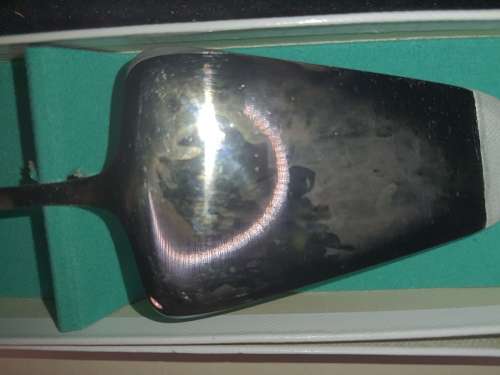 AN ANTIQUE CHROMATA CAKE CUTTER MADE IN HOLLAND SOLD AS IS