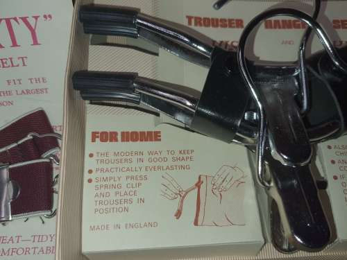 A VINTAGE TRAVELERS TROUSER HANGER IN ITS ORIGINAL BOX SOLD AS IS