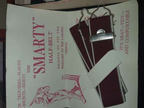 A VINTAGE TRAVELERS TROUSER HANGER IN ITS ORIGINAL BOX SOLD AS IS