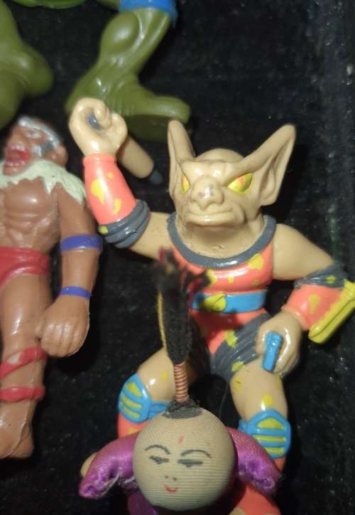 A COLLECTION OF VINTAGE TOYS SOLD AS IS