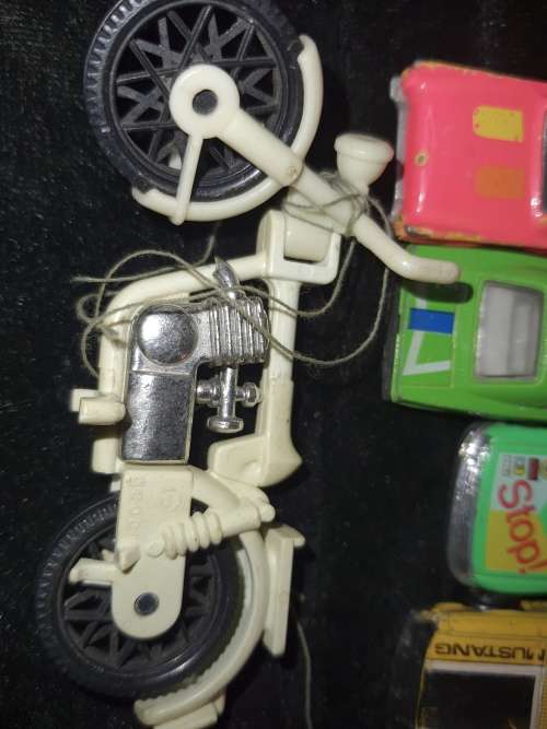 A COLLECTION OF VINTAGE TOYS SOLD AS IS