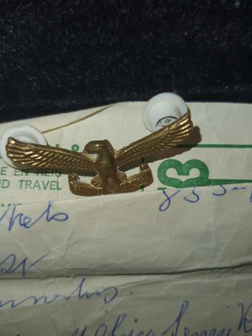A COLLECTION OF MILITARIA BADGES WITH PAPERWORK SOLD AS IS