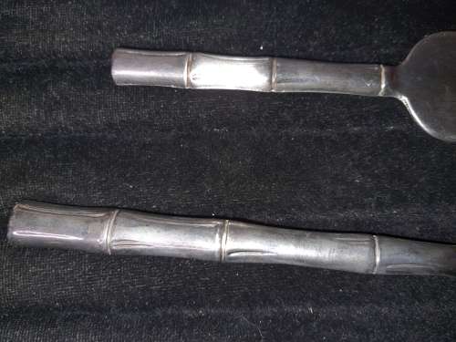 TWO STAINLESS STEEL CAKE LIFTERS SOLD AS IS