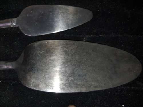 TWO STAINLESS STEEL CAKE LIFTERS SOLD AS IS