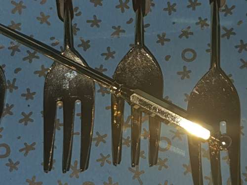 A COMPLETE SET GOLD PLATED COCKTAIL FORKS SOLD AS IS