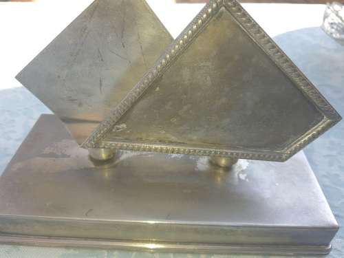 A VINTAGE STAINLESS STEEL SERVIETTE HOLDER