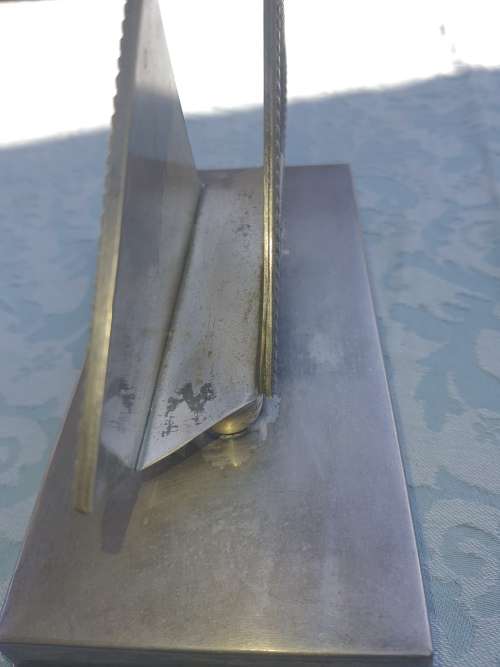 A VINTAGE STAINLESS STEEL SERVIETTE HOLDER