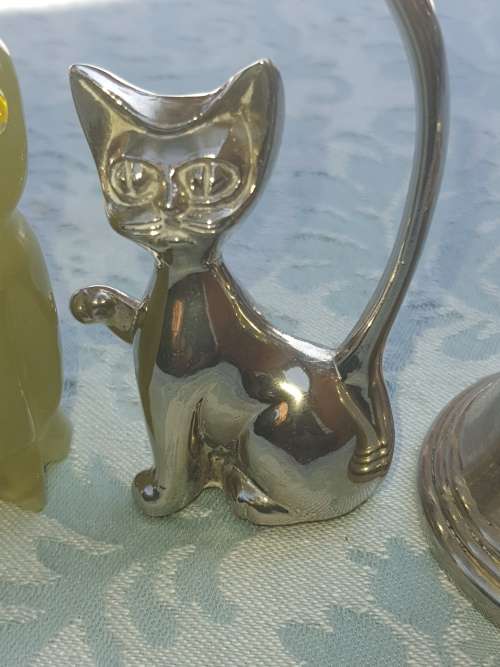A COLLECTION OF FIGURINES JADE AND SILVER-PLATED BELL AND A BULOVA WATCH SOLD AS IS