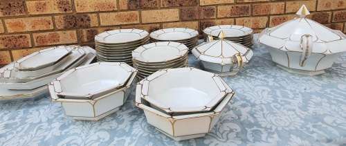 A COMPLETE BAVARIAN DINNER SET WITH GOLD TRIM IN GREAT CONDITION,