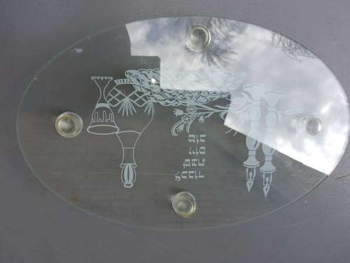 AN OVAL GLASS PLATTER WITH A JEWISH THEME SOLD AS IS