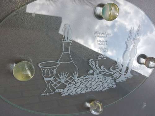 AN OVAL GLASS PLATTER WITH A JEWISH THEME SOLD AS IS