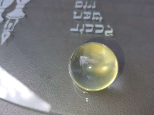 AN OVAL GLASS PLATTER WITH A JEWISH THEME SOLD AS IS