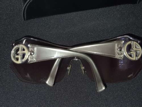 A VINTAGE WOMANS GEORGIO ARMANI SUNGLASSES SOLD AS IS
