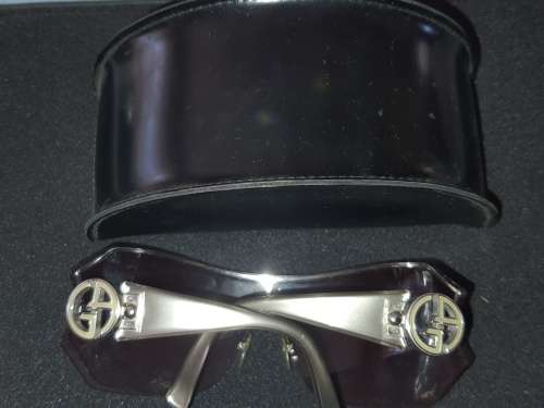 A VINTAGE WOMANS GEORGIO ARMANI SUNGLASSES SOLD AS IS