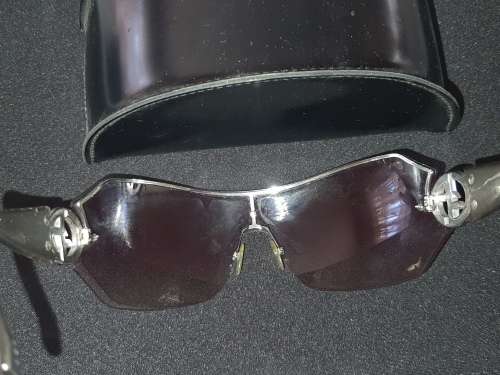 A VINTAGE WOMANS GEORGIO ARMANI SUNGLASSES SOLD AS IS