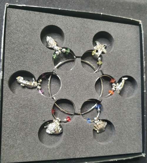 A BEAUTIFULL AND IN GREAT CONDITION CHRISTMAS WINE GLASS CHARMS FROM THE SEA