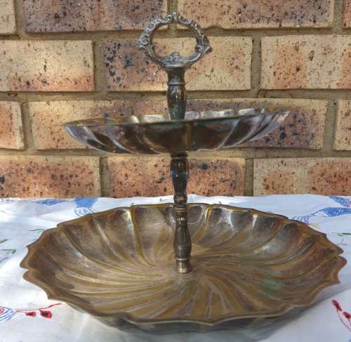 A VINTAGE SILVER PLATED 2 TIER SERVING TRAY SOLD AS IS