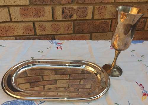A JOBOT SILVER PLATED TRAY AND A WINE FLUTE SOLD AS IS