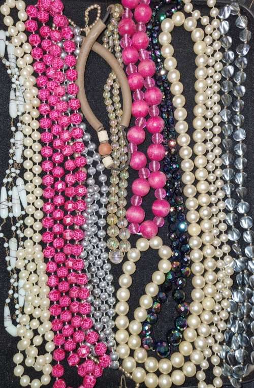 A VINTAGE COLLECTION OF COSTUME BEADED NECKLACES SOLD AS IS