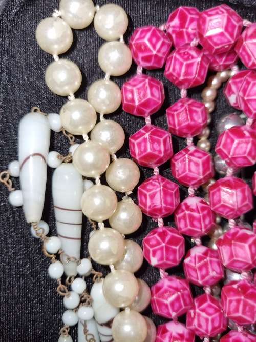 A VINTAGE COLLECTION OF COSTUME BEADED NECKLACES SOLD AS IS