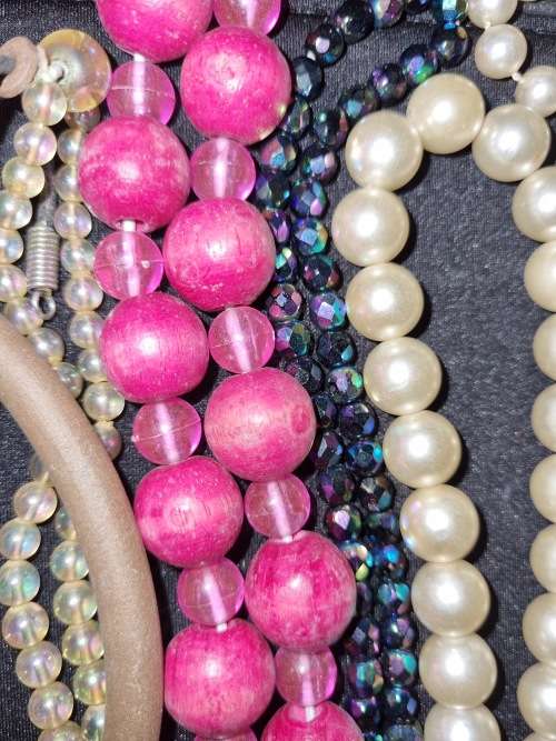 A VINTAGE COLLECTION OF COSTUME BEADED NECKLACES SOLD AS IS