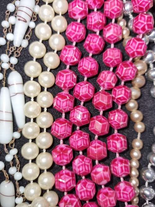 A VINTAGE COLLECTION OF COSTUME BEADED NECKLACES SOLD AS IS