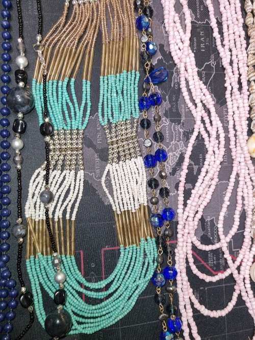 A VINTAGE JOBLOT FASHION AND ETHNIC BEADED COSTUME NECKLACES SOLD AS IS