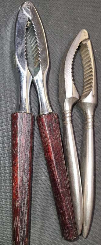 TWO VINTAGE STEEL NUT CRACKERS IN GOOD CONDITION SOLD AS IS