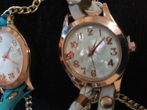 A WOMANS COSTUME SET OF 3 NECKLACES QUARTZ WATCHES SOLD AS IS NOT TESTED