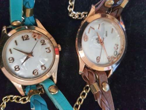A WOMANS COSTUME SET OF 3 NECKLACES QUARTZ WATCHES SOLD AS IS NOT TESTED