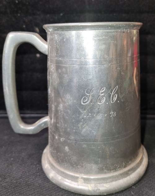 A VINTAGE SILVER-PLATED BEER MUG SOLD AS IS