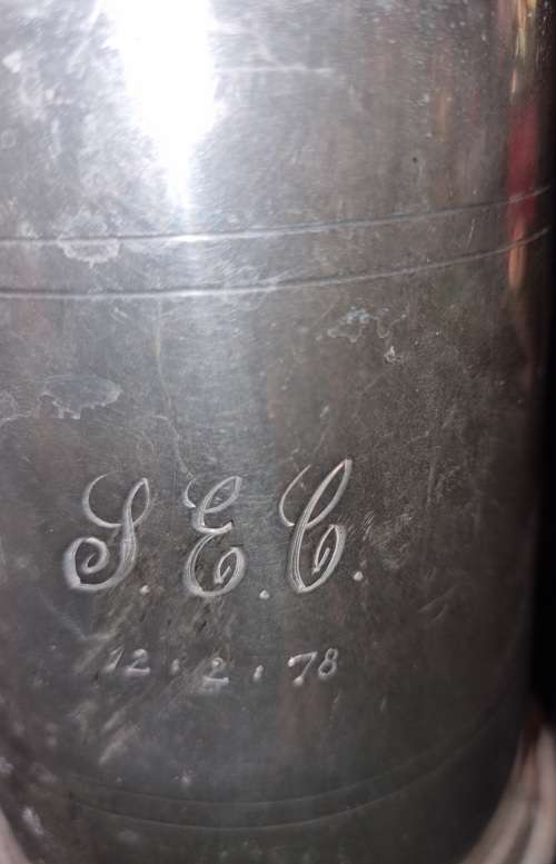 A VINTAGE SILVER-PLATED BEER MUG SOLD AS IS