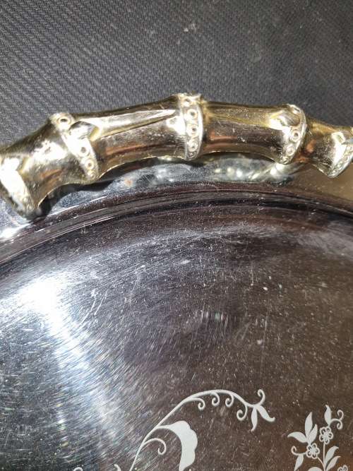 A NEAT VINTAGE STAINLESS STEEL AND BRASS HANDLED SERVING TRAY SOLD AS IS